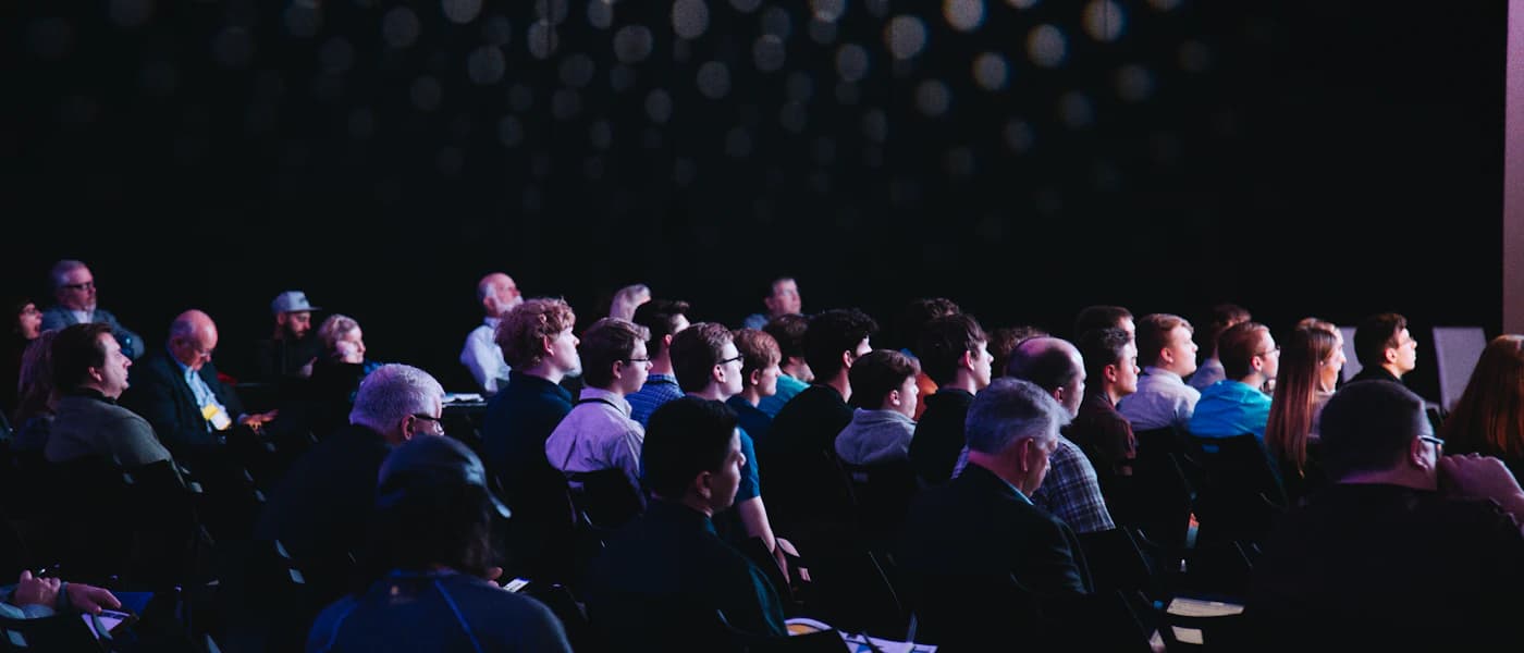 Audience gathered in a conference auditorium